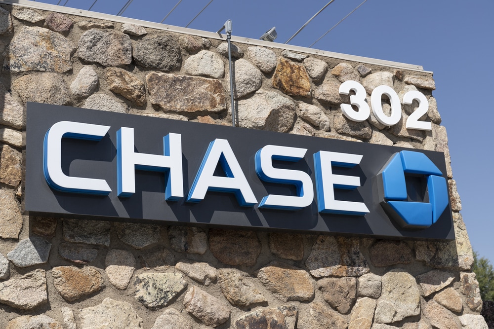 Chase bank signage with large, bold lettering on a stone wall background.