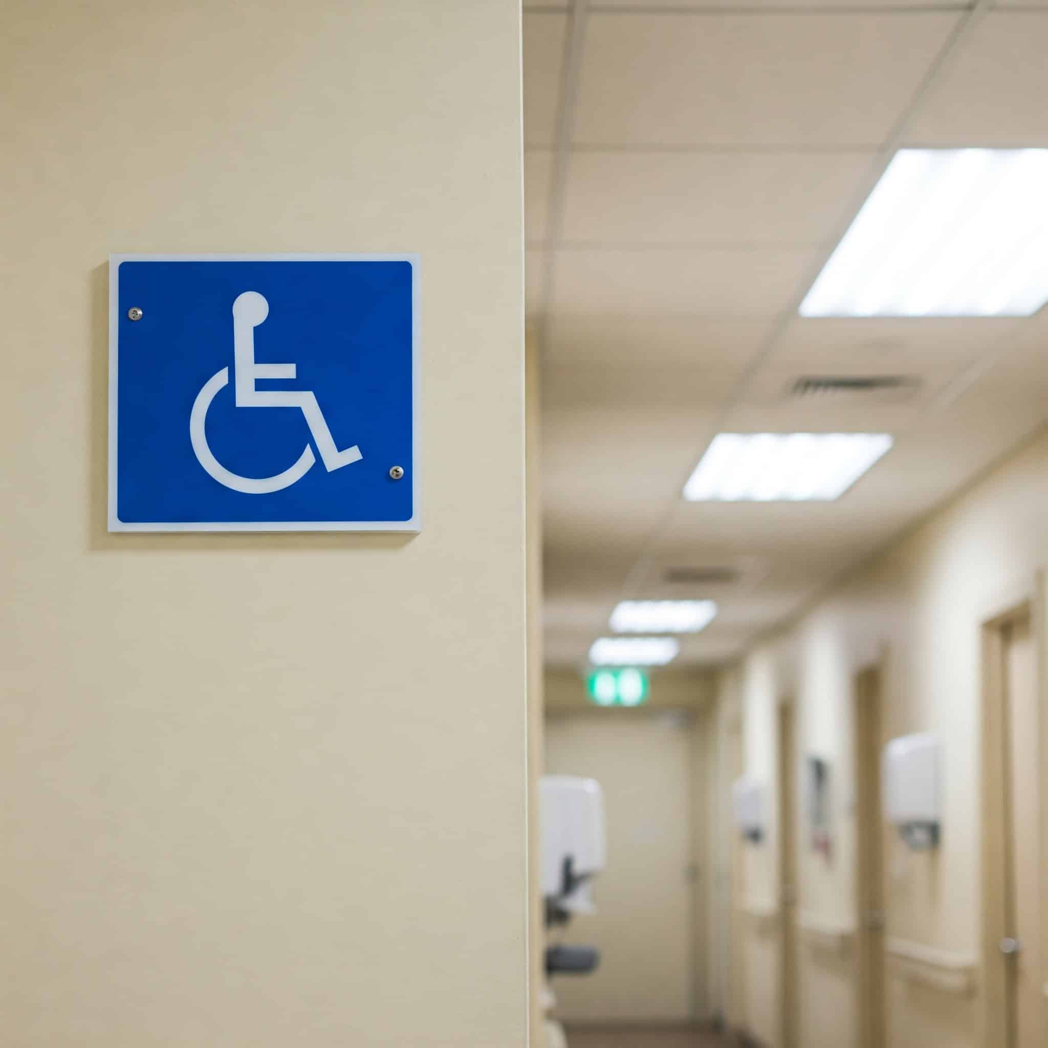 A clear visual marker indicating accessibility within a hospital environment.