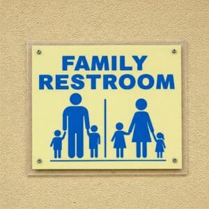 ayfinding sign for a family restroom in a shopping center.