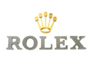 High-end brands like Rolex often choose fabricated metal signage for its durability and sophisticated appearance, reinforcing their brand identity with quality materials.